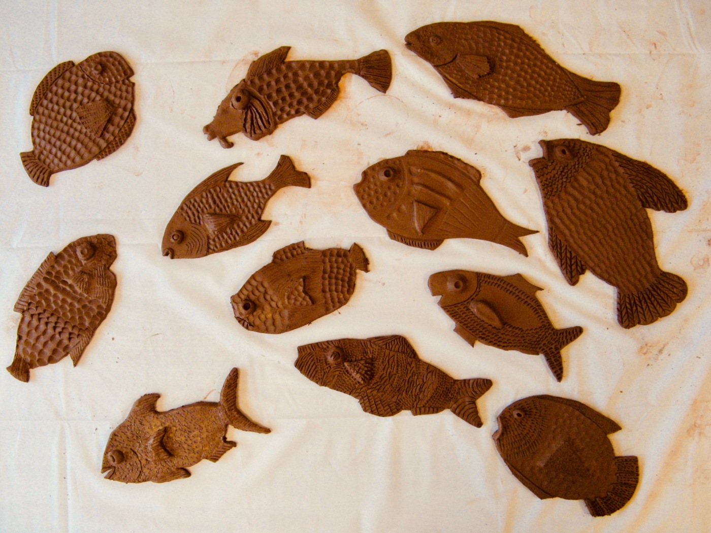 Handmade clay fish made during the Island Project workshop